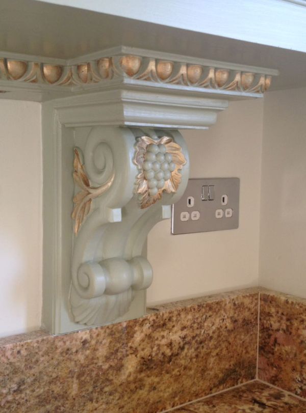 This Large Vine Leaf Corbel, Product code PN 679, enhances the under cupboard area in this themed kitchen. There are a wide range of vine leaf corbels and applique carvings available