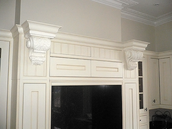 Kitchen corbels (item code PN798) have been painted white and they make a very grand design in this large family home.